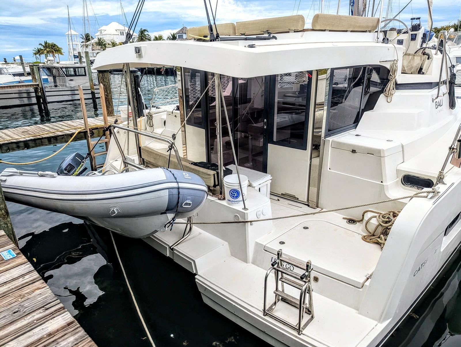 Aft cockpit deck area with marina view and stairs