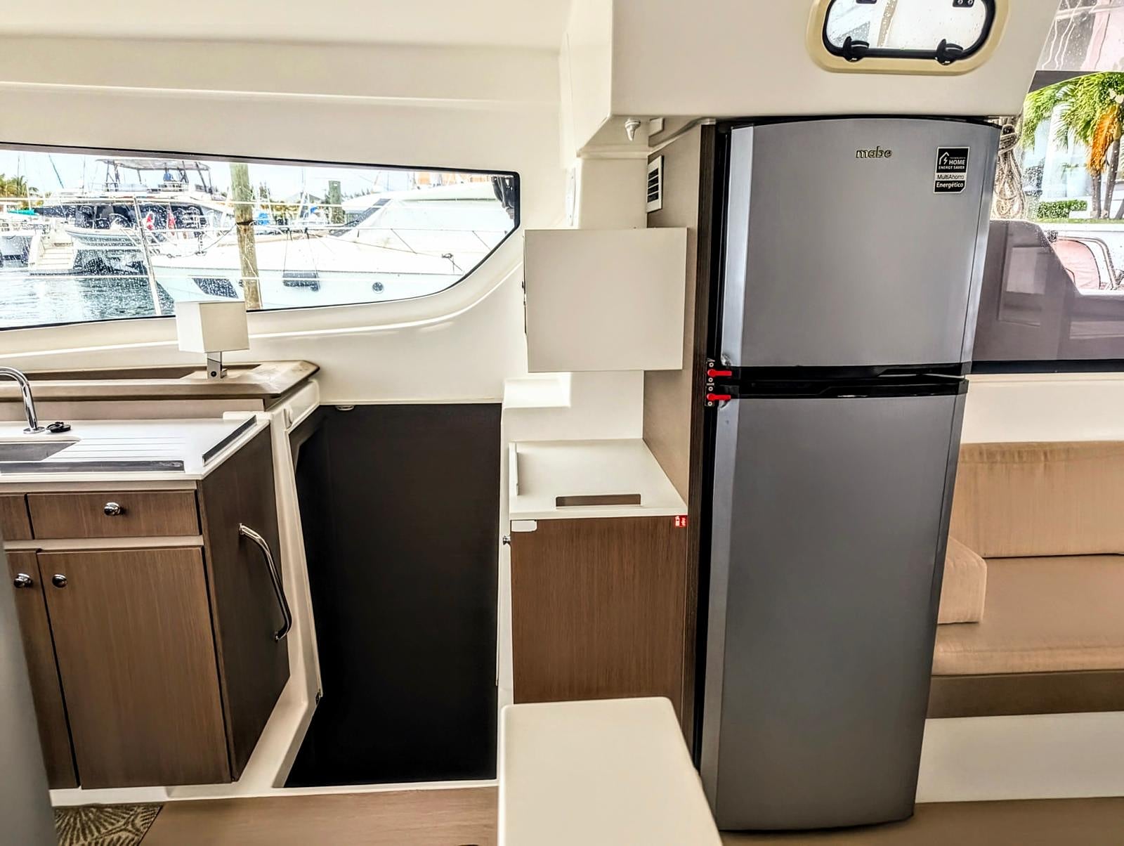Galley with stainless steel refrigerator and storage